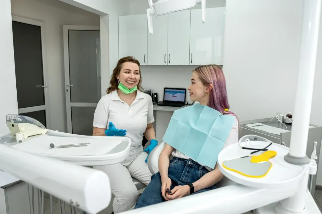 Dentist talking with a patient before treatment